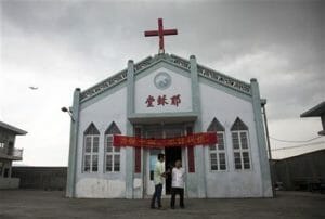 Toppled crosses in China spur defiance in The Associated press