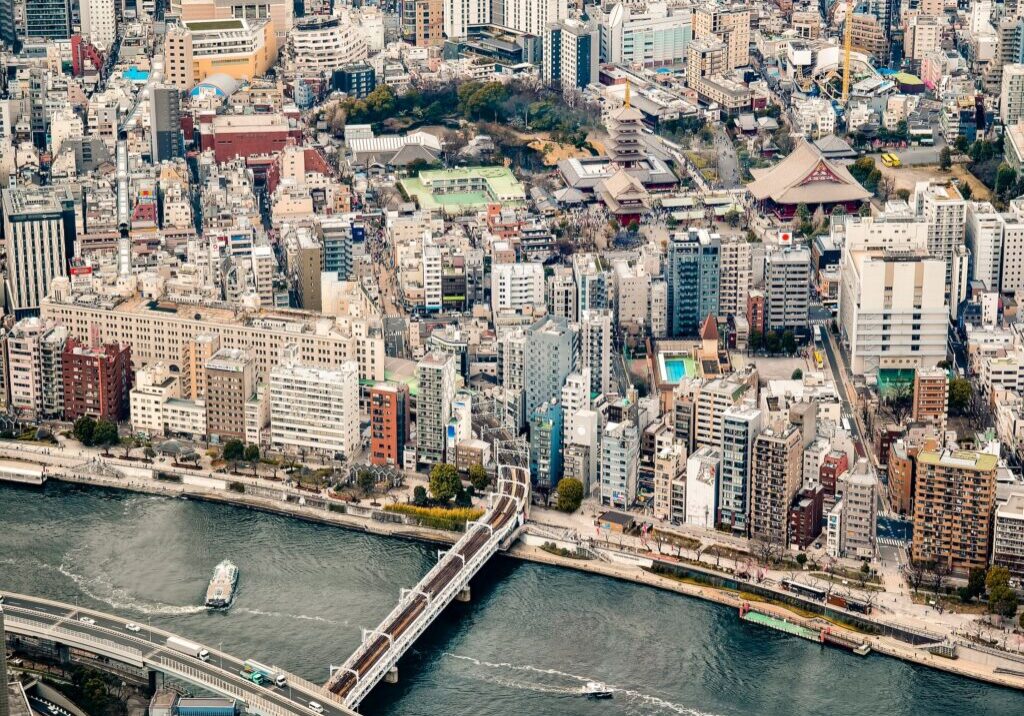 Tokyo, Japan - March 24, 2025: View from Tokyo Skytree showing the Sumida River Walk, Asakusa neighborhood, and Senso-ji Temple nestled among modern Tokyo buildings.